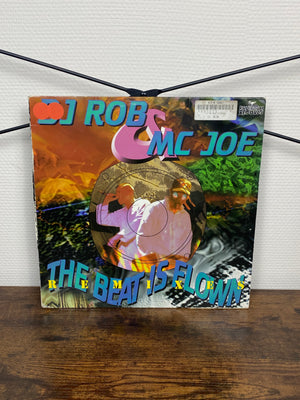 (1996) DJ Rob & MC Joe – The Beat Is Flown (Remixes) - (Vinyl)