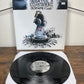 (2010) Negative A / Counterfeit – Disturbing Music For Disturbing Times (Vinyl)